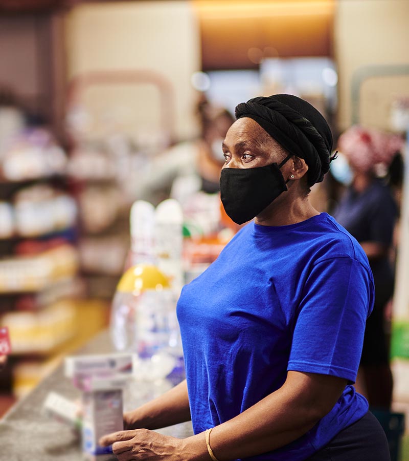 Vitamin supplements being cashed by a cashier